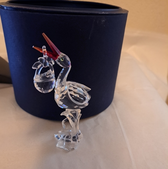 Swarovski Other - Pristine Swarovski crystal  stork w baby in basket, & original  cylinder 659401